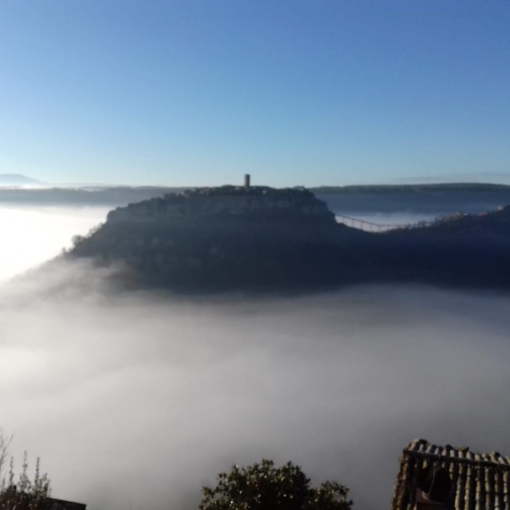 Civita rising above a sea of morning fog
