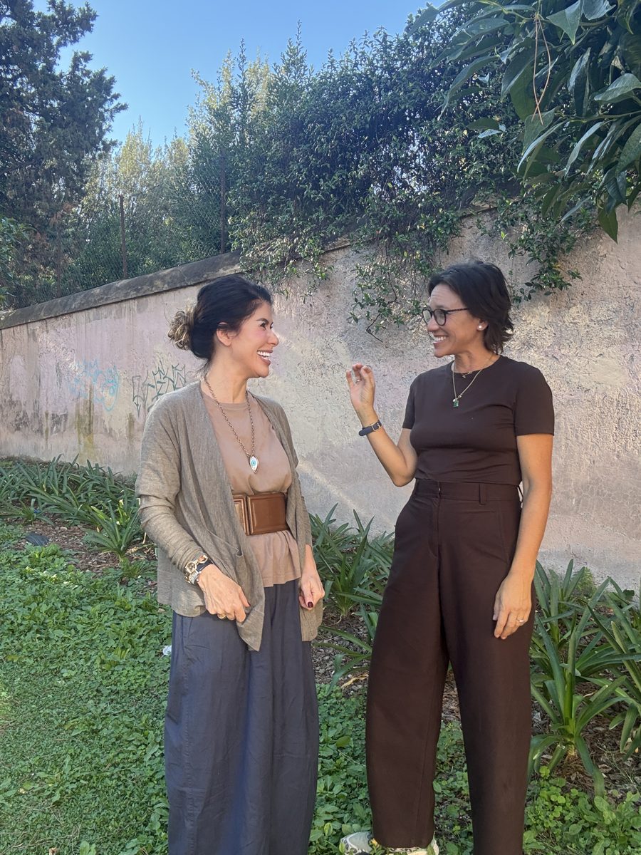 Jade and Francesca talking in a garden