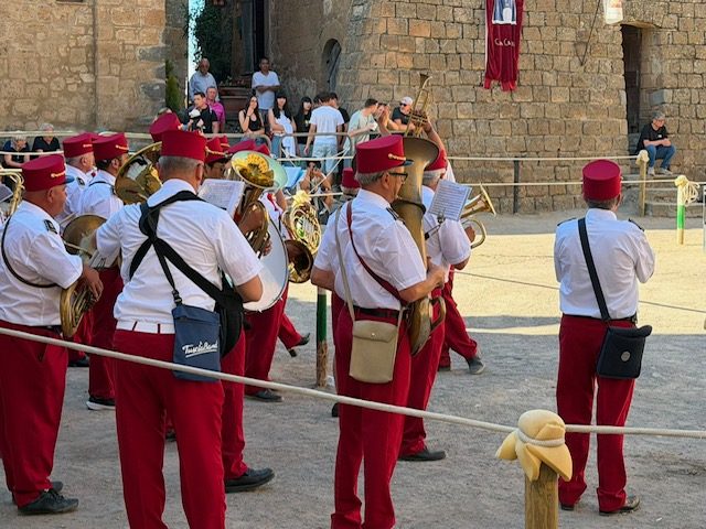 The town band in red uniforms
