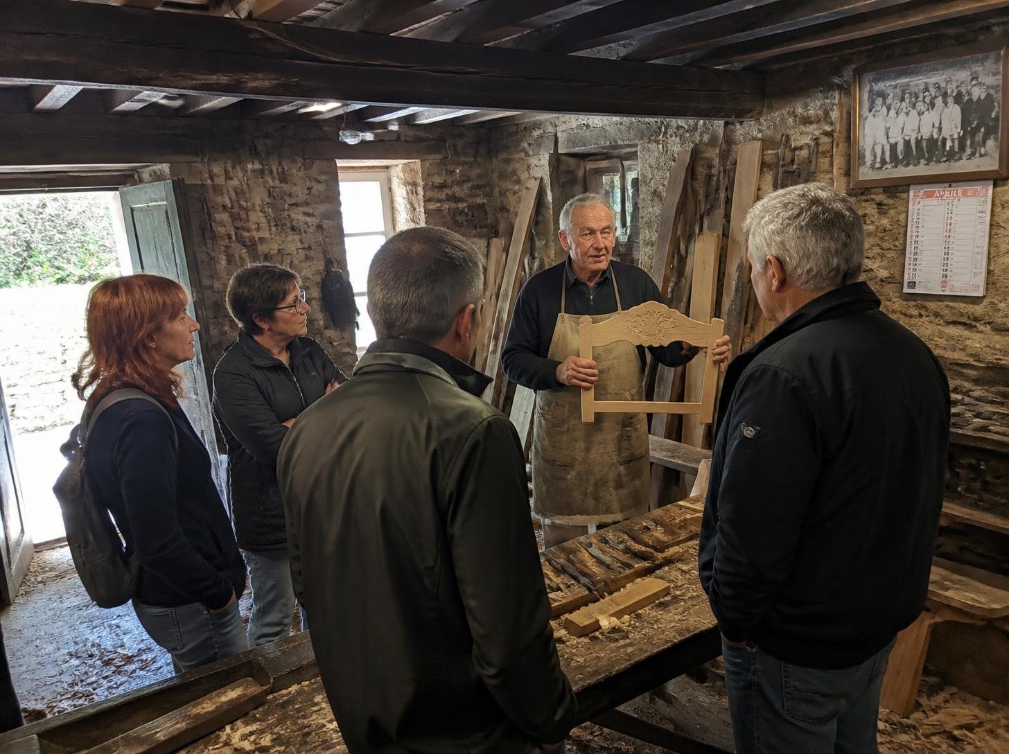 Visitors in a small family carpentry workshop